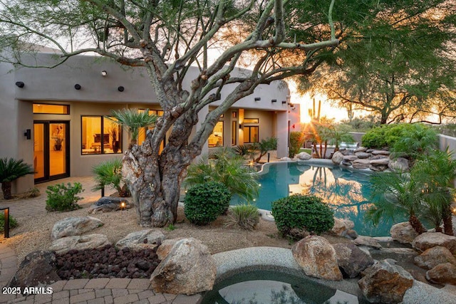 30600 N Pima Rd Unit 89, Scottsdale, AZ 85266 - pool at dusk featuring an outdoor pool