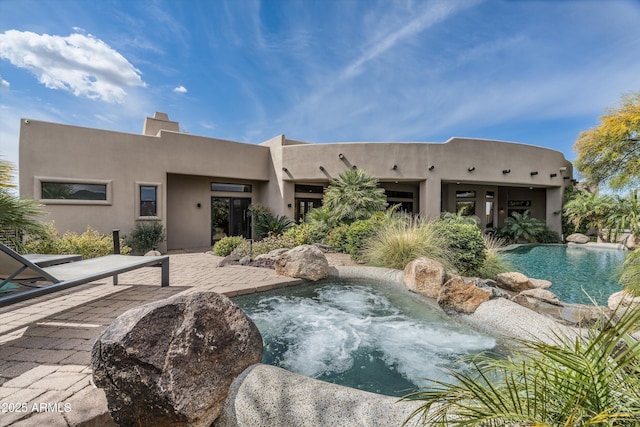 30600 N Pima Rd Unit 89, Scottsdale, AZ 85266 - exterior space with an in ground hot tub and a patio