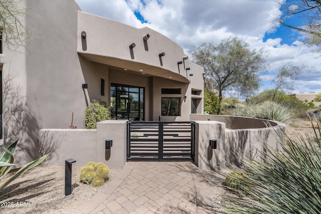 30600 N Pima Rd Unit 89, Scottsdale, AZ 85266 - property entrance with fence, stucco siding, and a gate