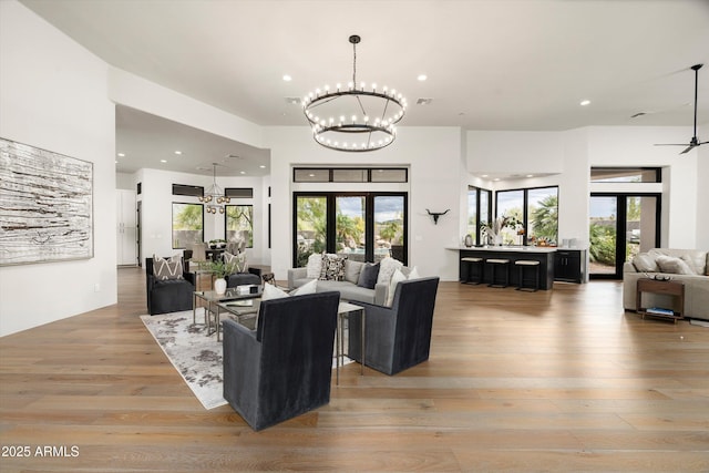 30600 N Pima Rd Unit 89, Scottsdale, AZ 85266 - living area with light wood finished floors, a notable chandelier, plenty of natural light, and recessed lighting