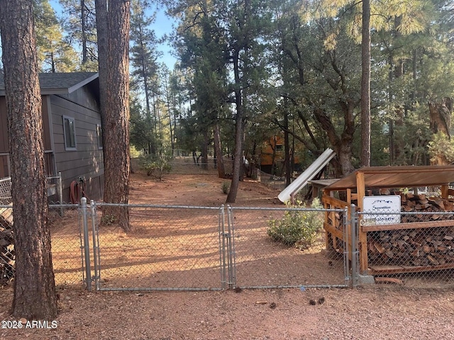 view of yard featuring a fenced front yard and a gate