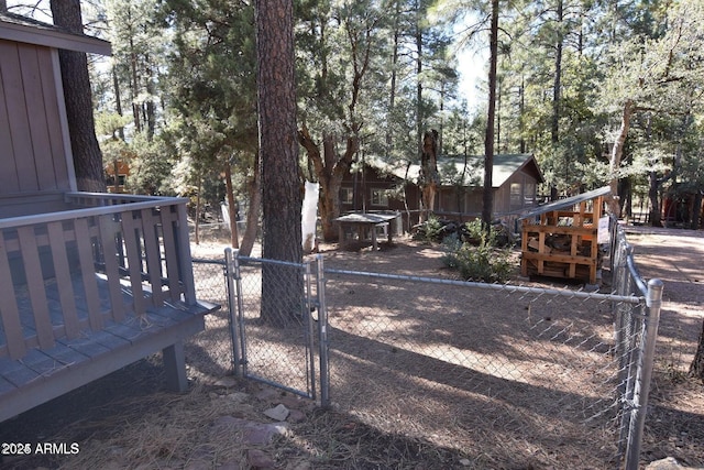 view of yard with fence and a gate