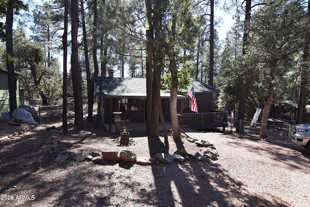 exterior space featuring fence and a wooden deck