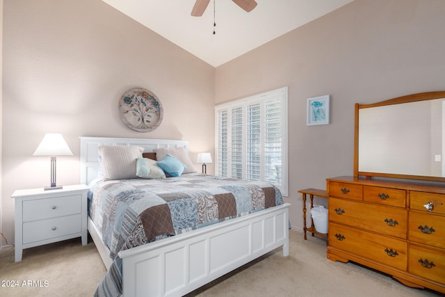 carpeted bedroom featuring lofted ceiling and ceiling fan