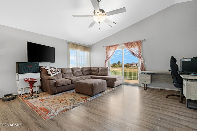 living room with wood finished floors, a healthy amount of sunlight, and ceiling fan