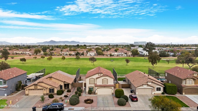 aerial view featuring a mountain view and a residential view