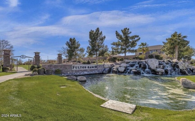 exterior space with a yard and a water view