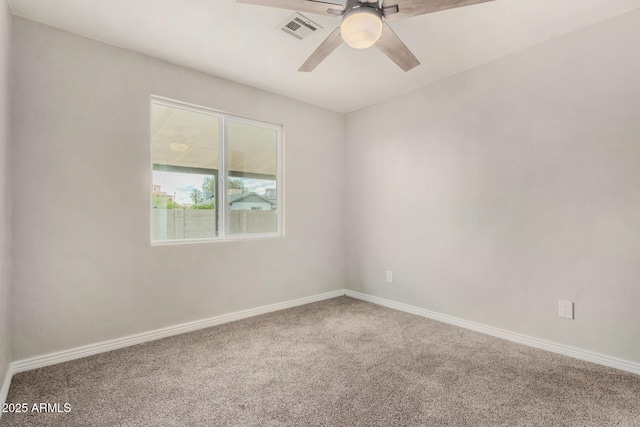 unfurnished room featuring a ceiling fan, carpet, visible vents, and baseboards