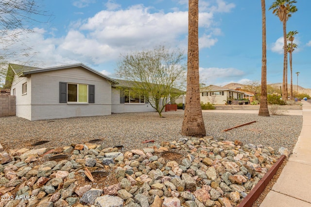 view of front of property featuring fence