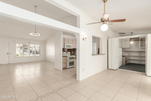 unfurnished living room featuring ceiling fan, light tile patterned floors, and high vaulted ceiling