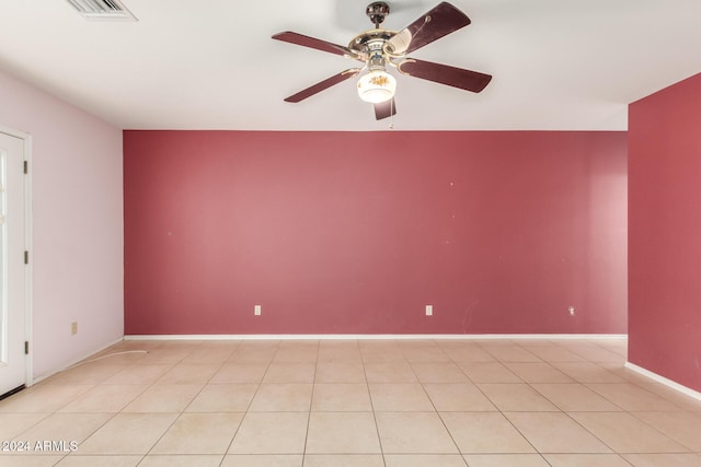 empty room featuring ceiling fan and light tile patterned floors