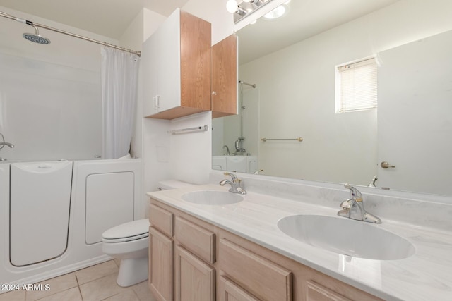 full bathroom featuring tile patterned flooring, vanity, toilet, and shower / bath combo with shower curtain