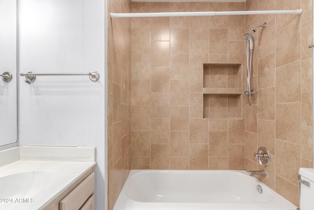 bathroom featuring vanity and tiled shower / bath combo