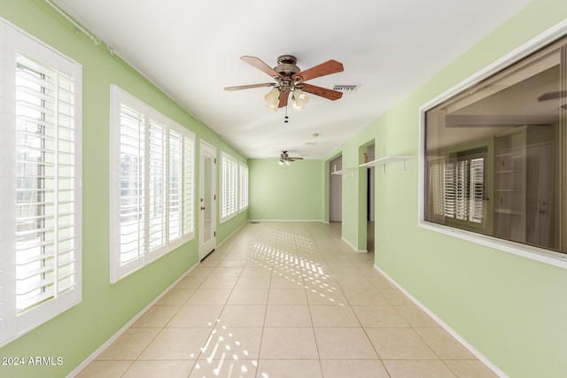 corridor with light tile patterned floors