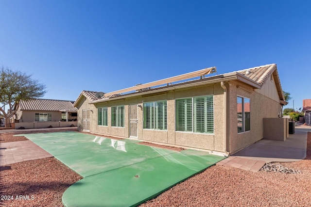 rear view of house with a patio