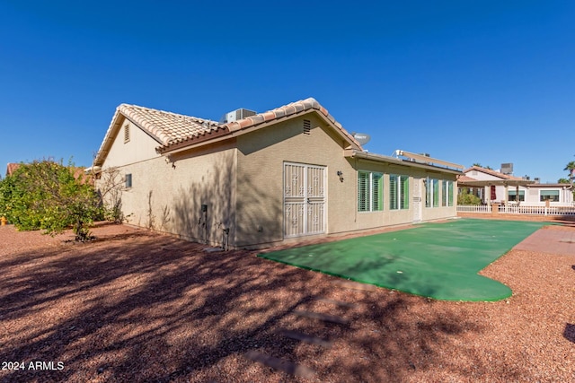 rear view of property featuring a patio area