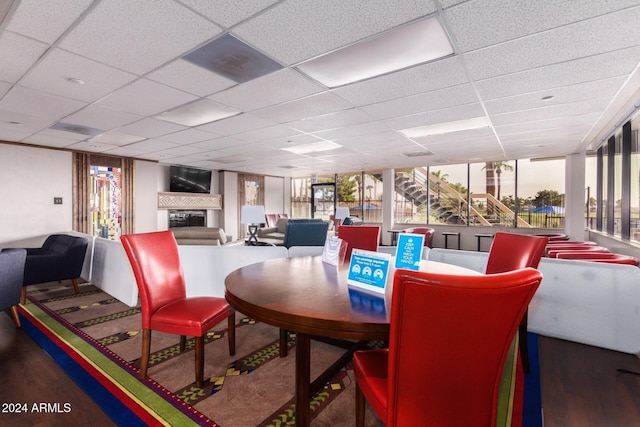 dining area with a drop ceiling