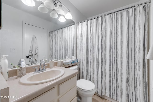 full bath featuring toilet and vanity