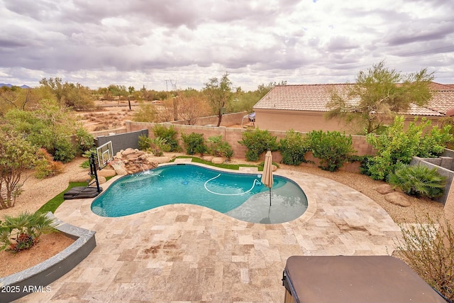 view of pool with a fenced in pool, a fenced backyard, and a patio