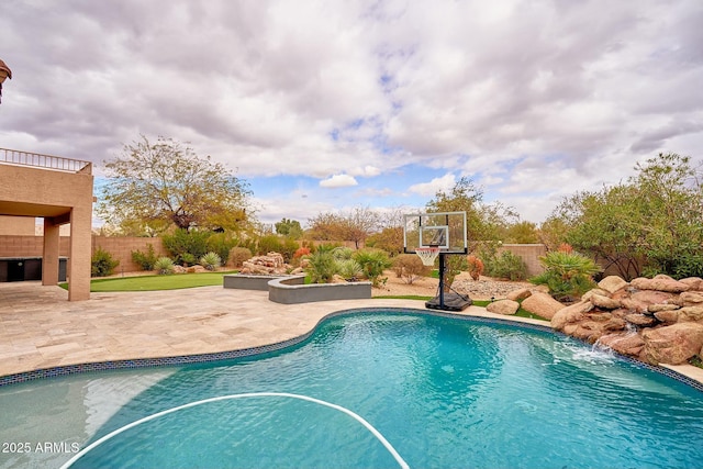 outdoor pool featuring a fenced backyard and a patio