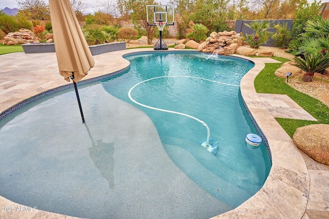 view of pool with a fenced in pool and a patio area