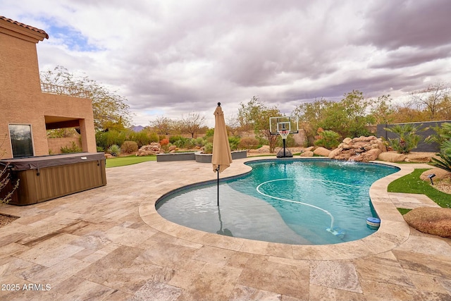 view of swimming pool featuring a patio area, a hot tub, and a fenced in pool