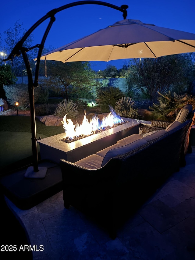 view of patio / terrace featuring an outdoor fire pit