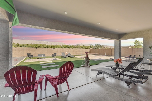 patio terrace at dusk with a lawn