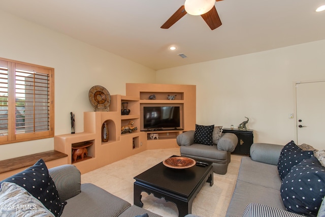 living area featuring built in shelves, recessed lighting, visible vents, and a ceiling fan