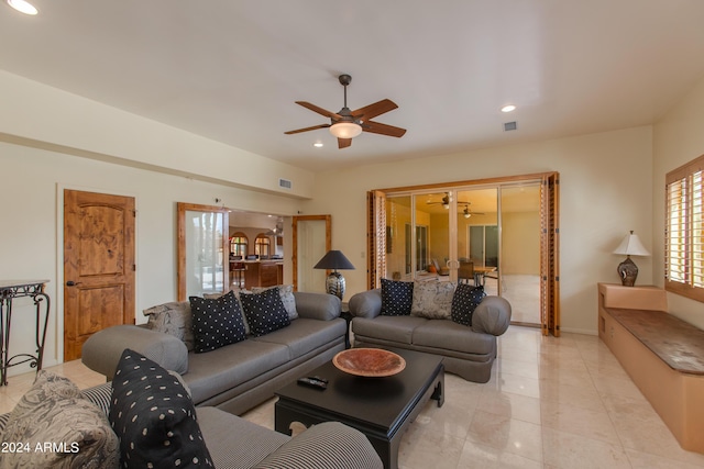 living room featuring light tile patterned floors, visible vents, a ceiling fan, and recessed lighting