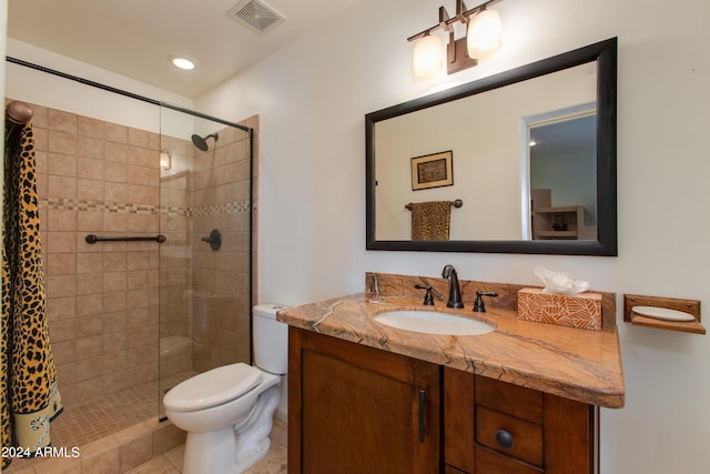 bathroom with visible vents, toilet, vanity, a shower stall, and recessed lighting