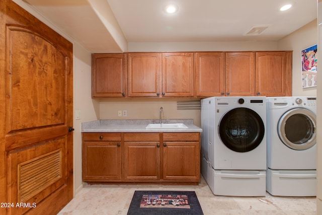 laundry area with recessed lighting, a sink, visible vents, cabinet space, and washing machine and clothes dryer