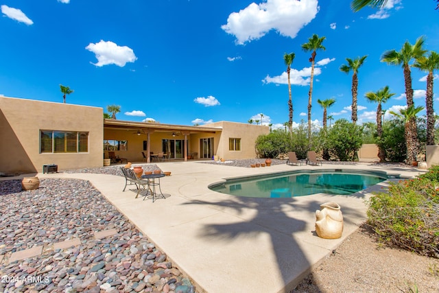 outdoor pool featuring a patio area and ceiling fan