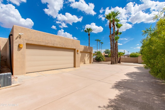 view of side of property featuring a garage