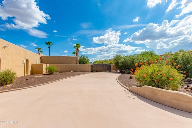 view of patio / terrace featuring fence and a gate