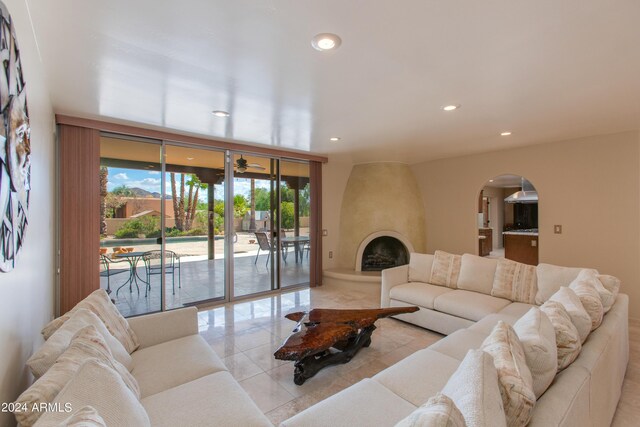 kitchen featuring backsplash, a kitchen island, island exhaust hood, a kitchen bar, and a skylight