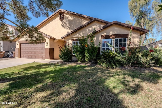 mediterranean / spanish house with a front lawn