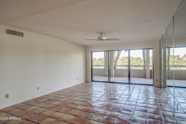 unfurnished room featuring visible vents, plenty of natural light, and ceiling fan