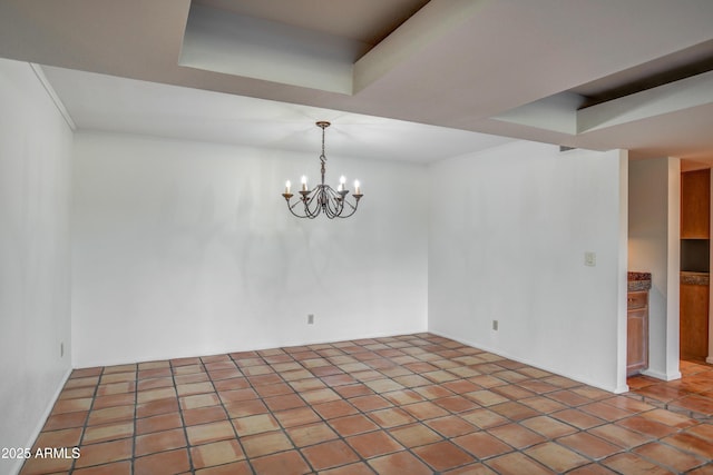 unfurnished room with light tile patterned floors, a tray ceiling, and a notable chandelier