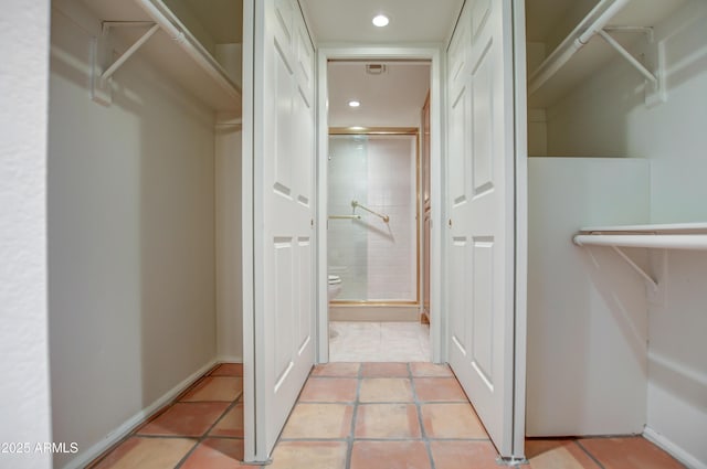 walk in closet featuring tile patterned flooring and visible vents