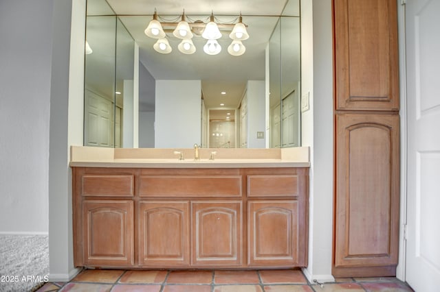 full bath featuring vanity and baseboards