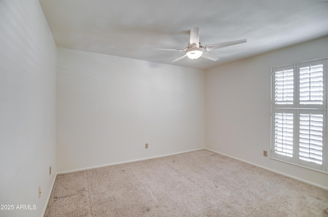 empty room with carpet and ceiling fan