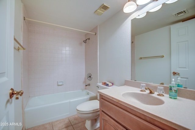 bathroom with tile patterned floors, visible vents, toilet, and vanity