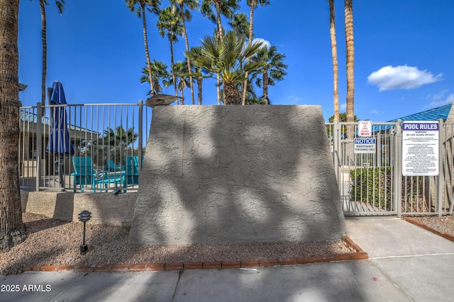 exterior space featuring fence and a gate