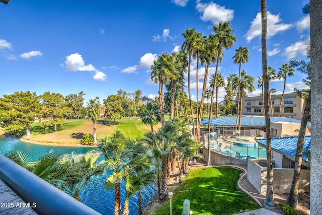 community pool featuring a water view