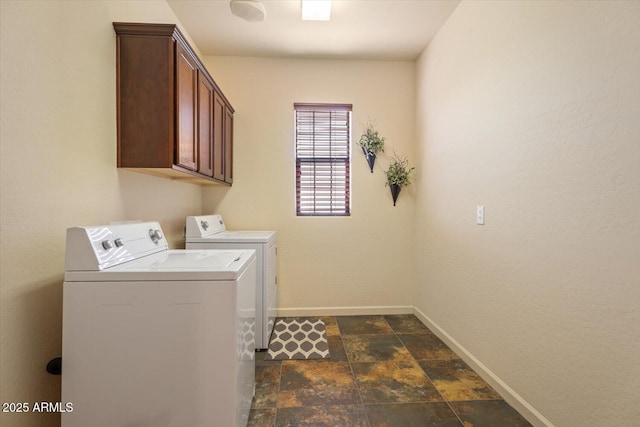 laundry area with cabinets and washing machine and dryer