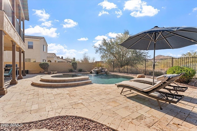 view of swimming pool with pool water feature, a patio area, an in ground hot tub, and grilling area