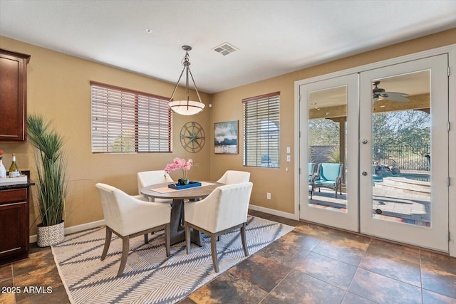 dining area with ceiling fan and french doors