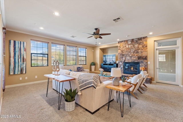 living room with light carpet, a fireplace, and ornamental molding