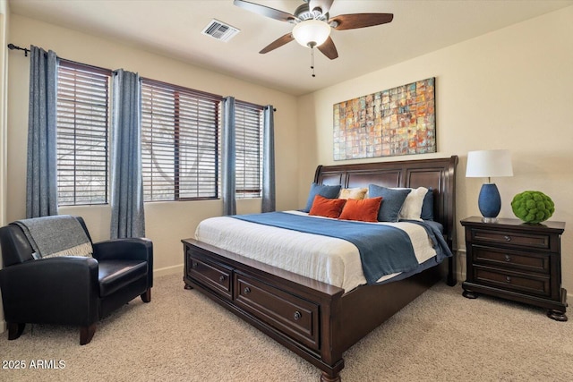 bedroom with light carpet and ceiling fan